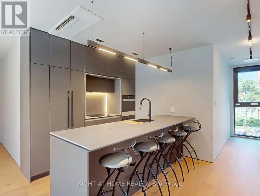 Kitchen island with seating for four and floor-to-ceiling cabinets