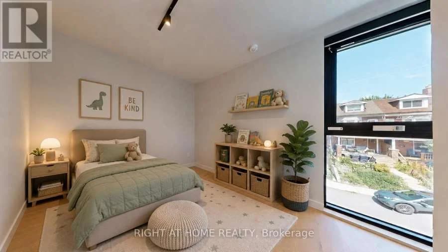 Bedroom with a large window over the street