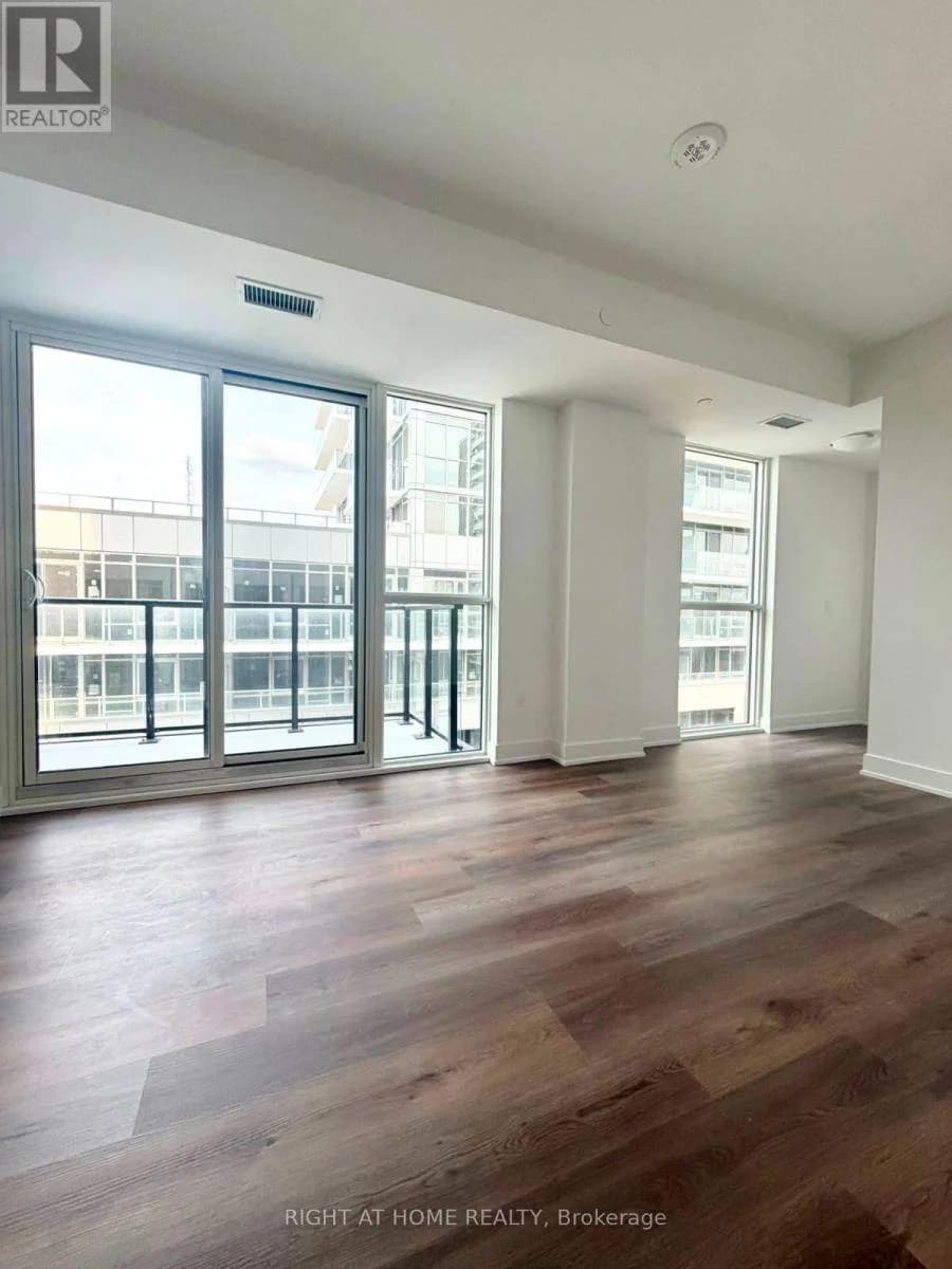 Bright room with a wall of windows and a glass balcony